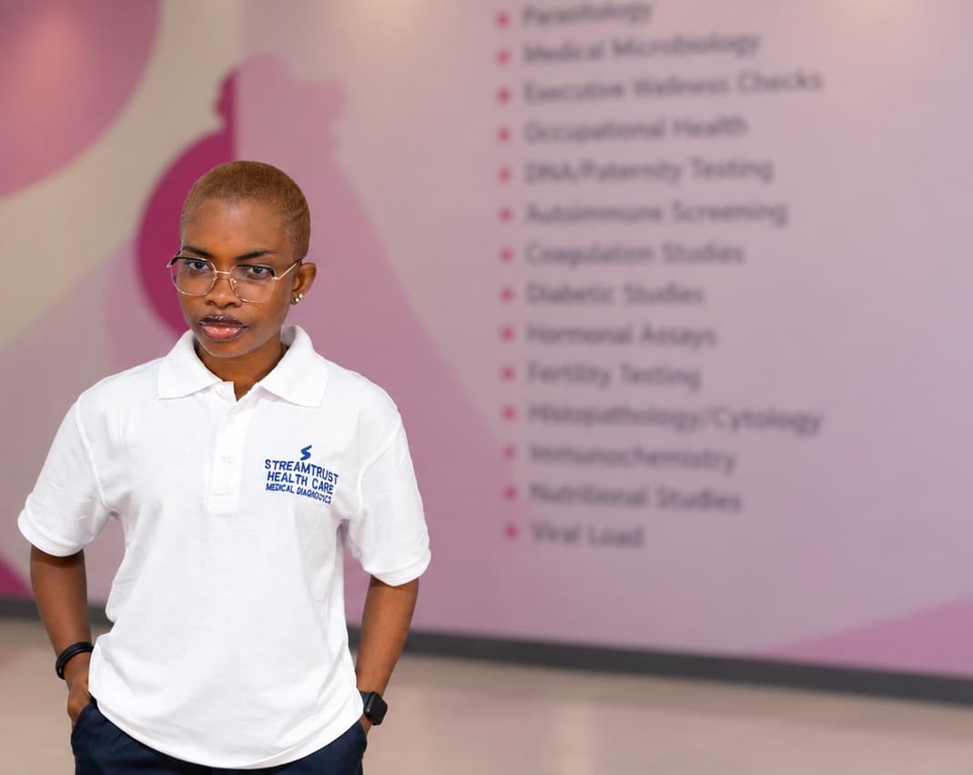 StreamTrust staff member in front of the centre service wall